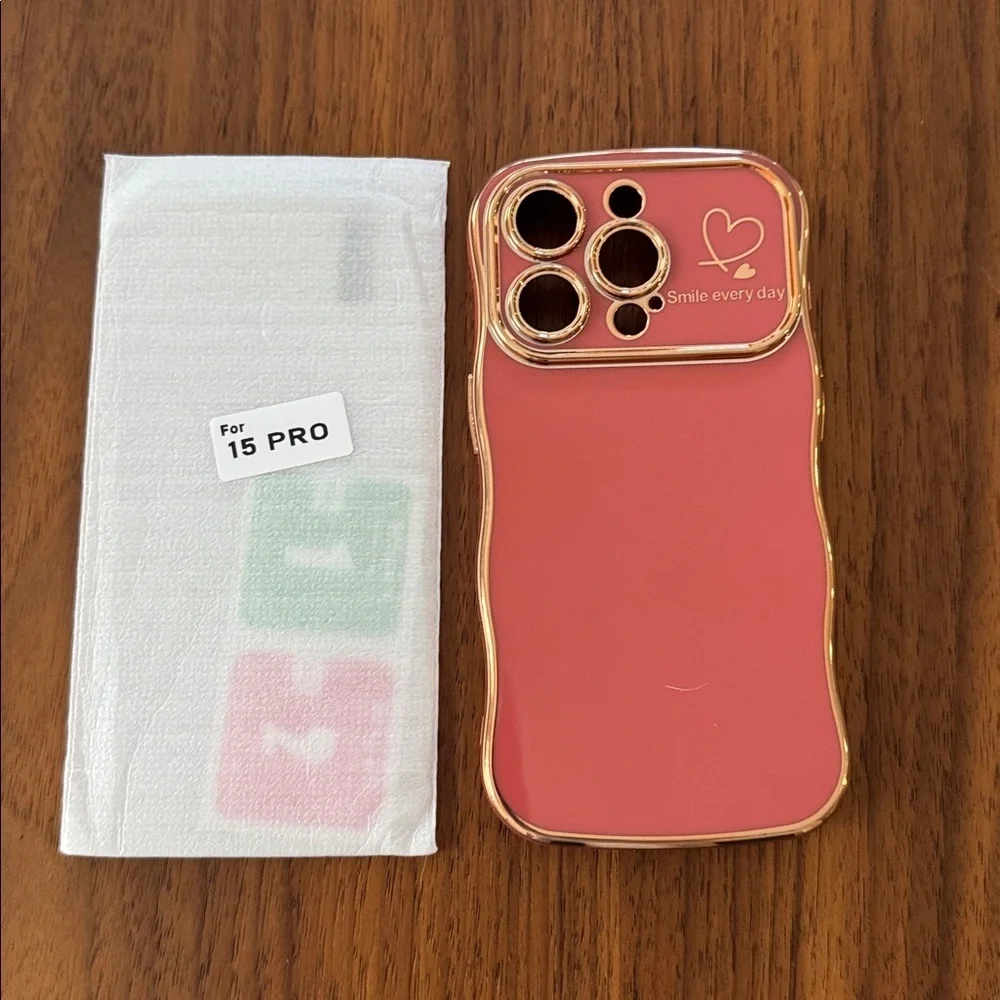 NWOT Faint Red Wave Phone Case for 15 Pro with Gold Trim.